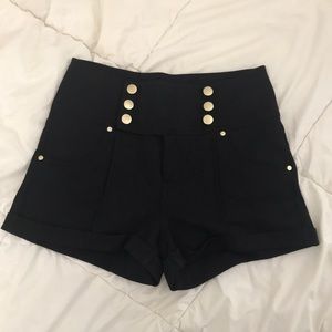 high waisted black shorts with gold buttons